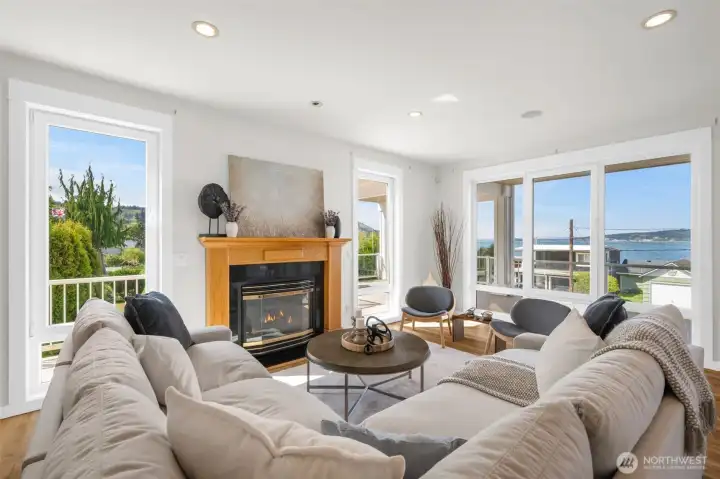 Relax in the living room with gas fireplace and take in stunning views.