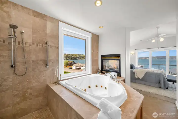 Jetted tub with double sided gas fireplace.