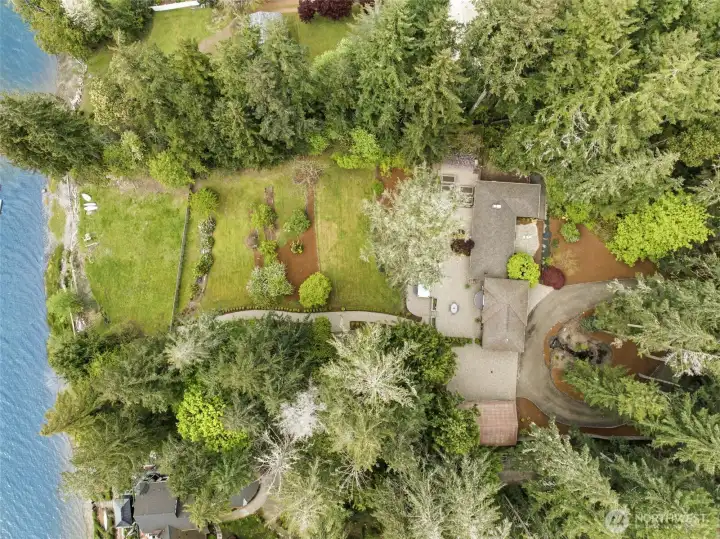 Aerial view of the tidelands and home overlooking the water.