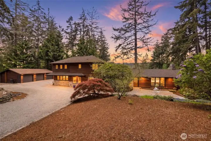 Front of the main home with a detached 3-car garage.