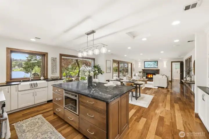 Open concept kitchen, dining and living area. These rooms capture the views.