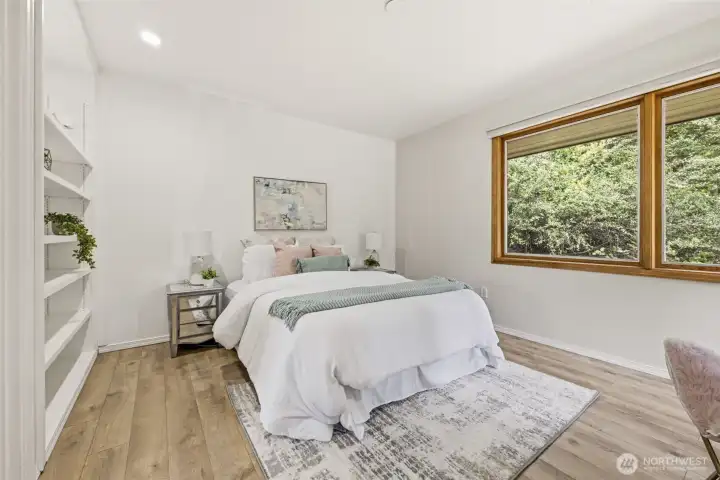 2 of 3 bedrooms which overlooks the front landscaping, plenty of built-in shelves.