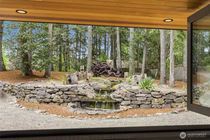 During the cooler months, you can shut these windows. Great view of the water feature and carved Kracken from an old tree stump!