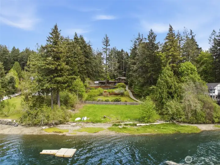 View of the property from the water. The swim platform belongs to this property.