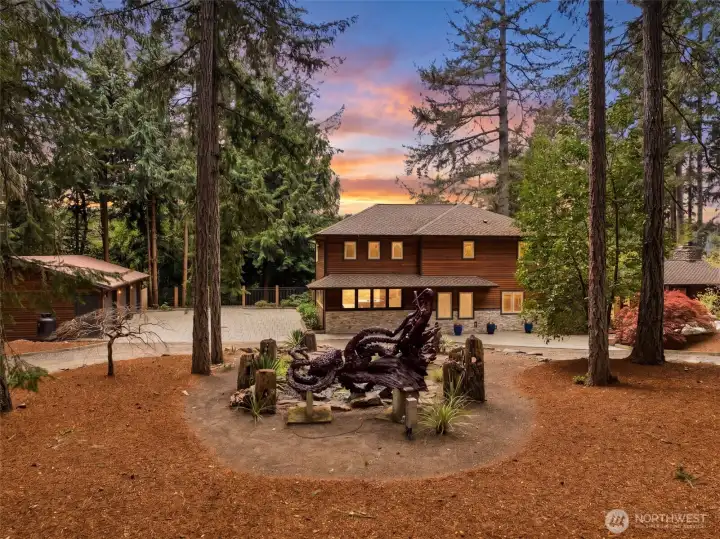 View of the water feature with a Kraken statue hand carved from an old tree stump.