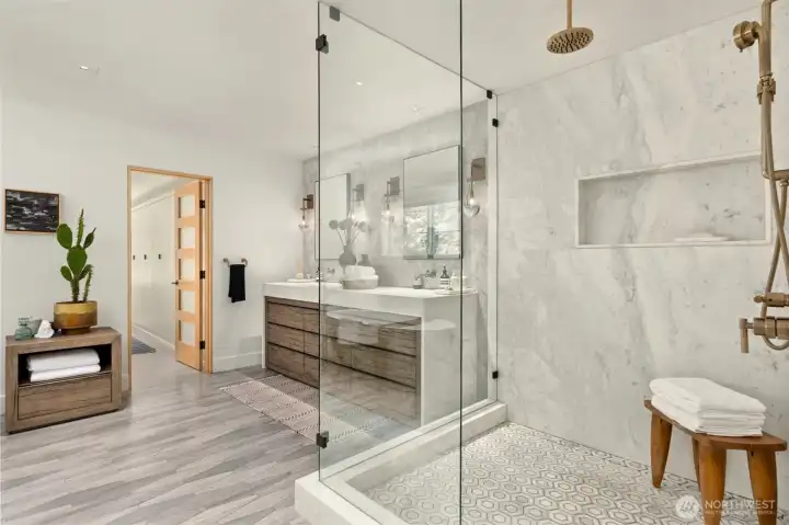 Limestone flooring, radiant heated floors, calacatta marble shower and bathroom walls.