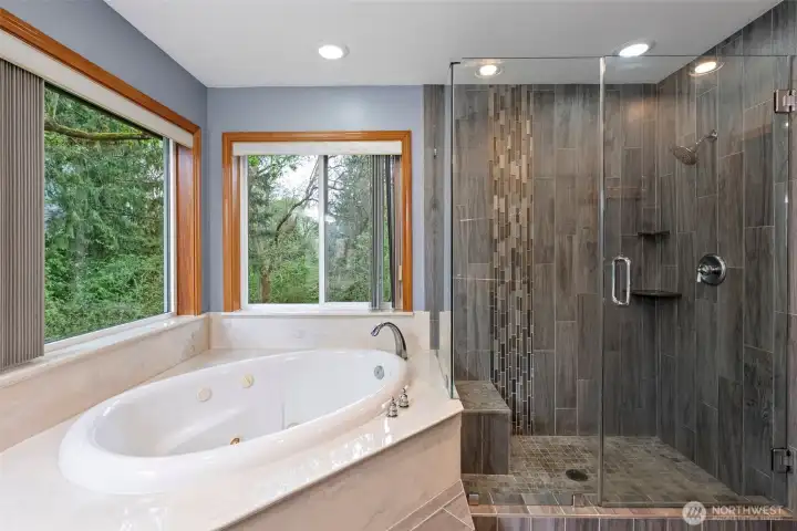 Primary Bathroom with jetted tub and updated shower enclosure Primary Bathroom with jetted tub and updated shower enclosure