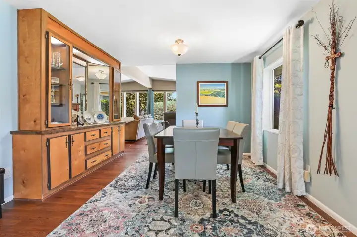 Formal living room and formal dining room with a built in hutch.
