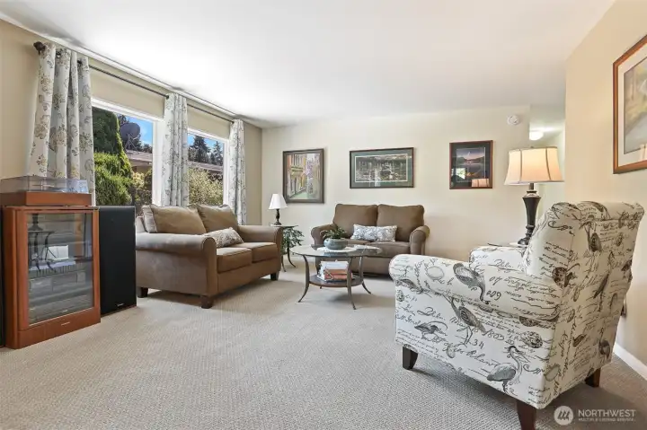 Formal living room and formal dining room with a built in hutch.