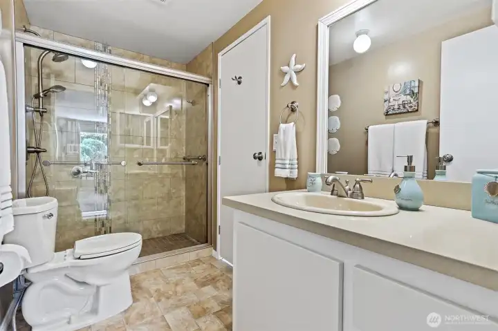 Updated 2nd full bathroom features tile shower and quartz countertops.