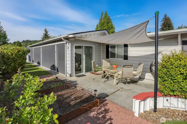 Back courtyard features 1 of three private back patios accessed from the sun/bonus room.