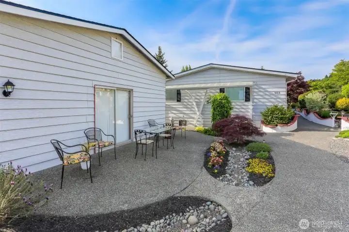 3rd of 3 patios on the street side, next to the detached garage, has a sliding door access.