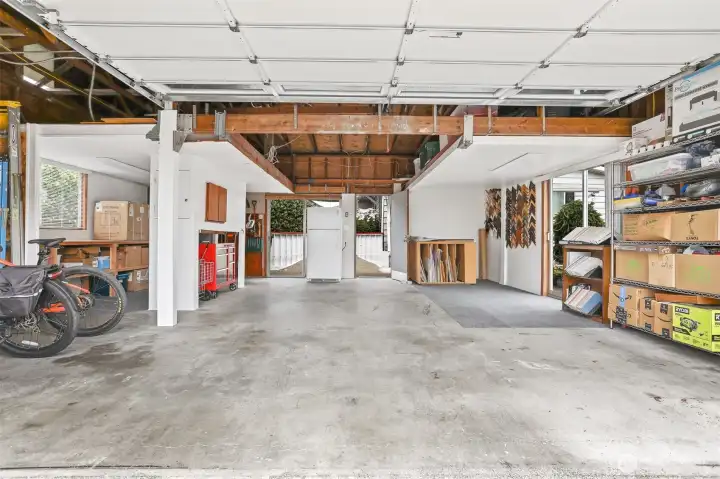 Extra large detached (624 sq ft per   SCR) 2 car garage with workshop space and an EV charger.