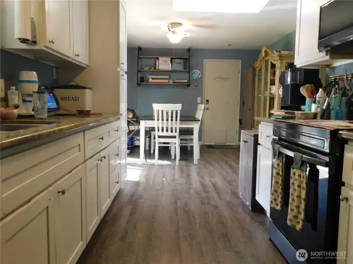 Galley style kitchen with nice quartz tops.
