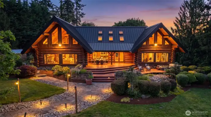 This extraordinary log home  offers a rare blend of timeless craftsmanship, natural beauty, and modern comfort!