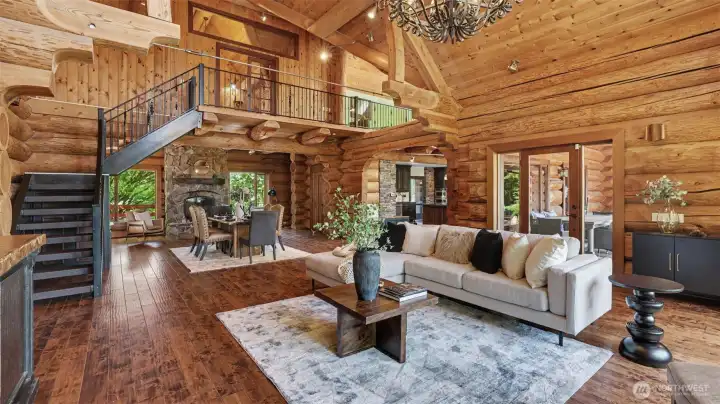 Dramatic great room is anchored by a  beautiful stone gas fireplace designed for both everyday living and entertaining.