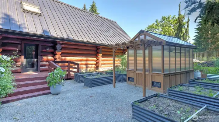 Greenhouse and raised beds created in 2024.