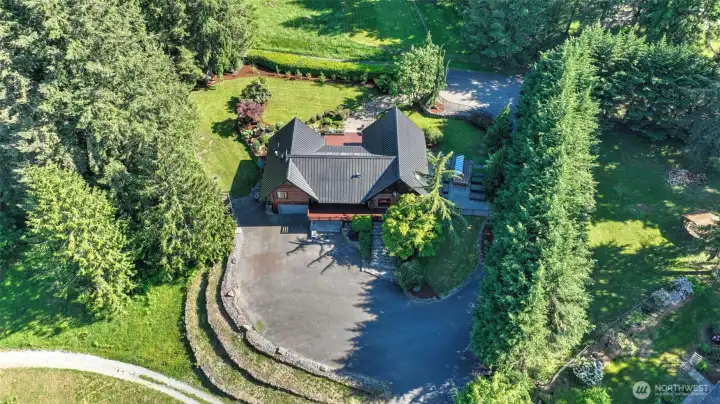 A picturesque yard with mature fruit trees adds character, shade, and seasonal enjoyment.