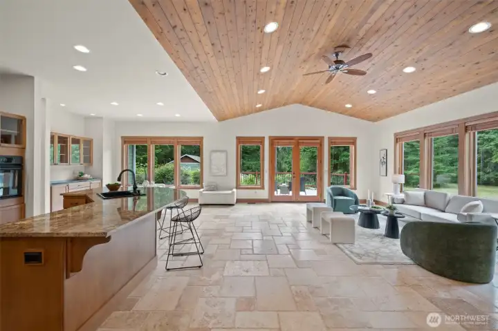 Tongue & groove wood-panel vaulted ceiling complements the 9'9" ceilings throughout the rest of the home