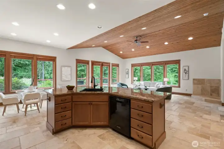 Generously-sized granite island provides room for all your guests