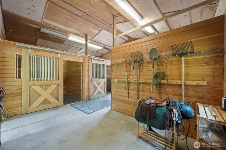 Tack area and 2 of the stalls. Potential to combine these 2 stalls for larger animals? Buyer to verify.