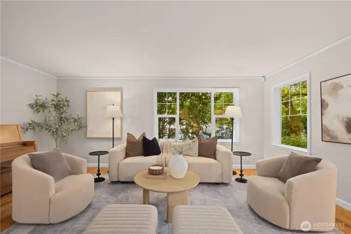 Large living room with windows overlooking the natural greenery. Large living room with windows overlooking the natural greenery.