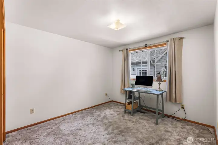 2nd bedroom overlooks the back yard and is currently used as an office