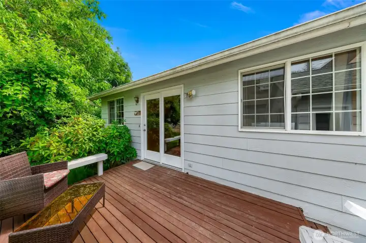 Wrap around benches on the deck.  French doors lead to the dining room