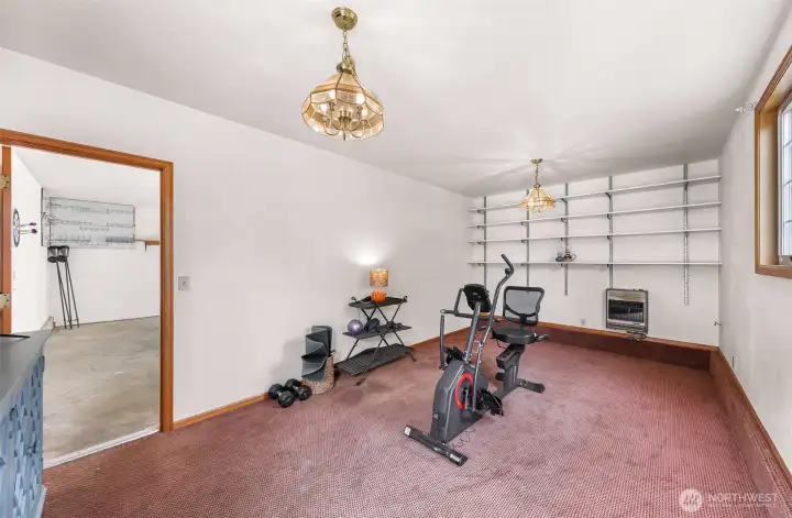 Another view of the bonus room with the door to the garage