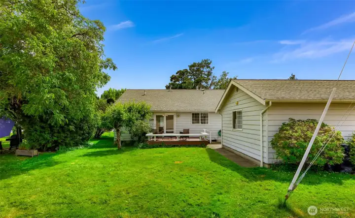 Rear view of this unit shows the private deck and yard