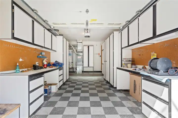 Garage is a great workspace and efficient storage area.