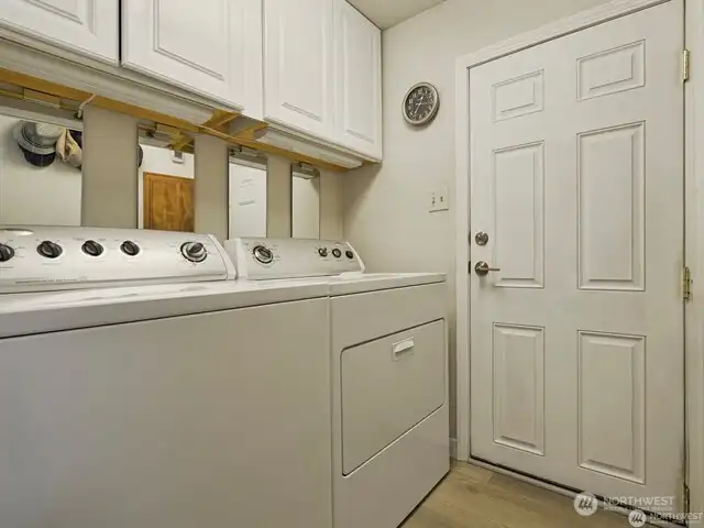 Entering your new one-level home from the back, you come in through the gleaming mud-room/utility room. Washer and dryer stay, there is abundant cabinet and storage space, and you’re greeted by gorgeous high end Luxury Vinyl Plank flooring which extends through the living areas and beyond. There is truly nothing to not love here!