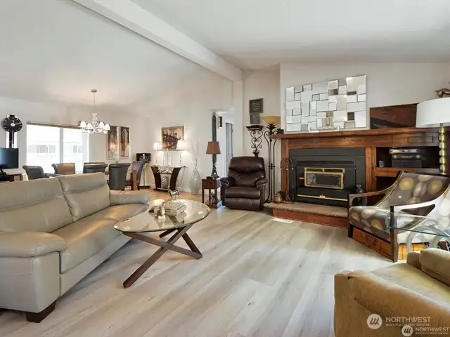 Your new home affords an expansive open floor plan with soaring ceilings over the living room and dining room. It’s light and bright with generously sized vinyl windows, and the living room is graced with a cozy and charming wood-burning fireplace. And the heat pump provides affordable heating AND air-conditioning for your year round comfort! It’s all here for you! And you’ll own your own yard - no rental fees here ever!