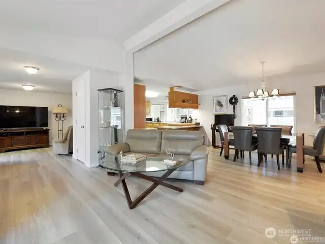Here you can see the family room to the left rear, and the formal dining area to the right, with the gleaming and open kitchen to the rear of center. This is a spacious and expansive home you’ll love to live in.