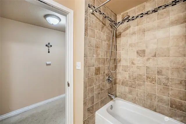 Downstairs bathroom tub and shower