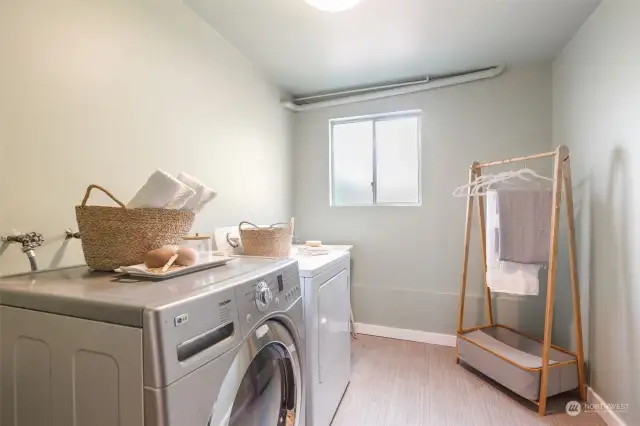 Laundry room with utility sink and room for storage