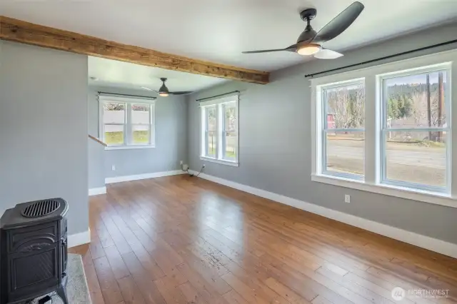 Living room with freestanding propane stove is warm and welcoming.