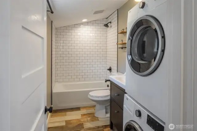 Main floor bathroom with stackable washer and dryer.