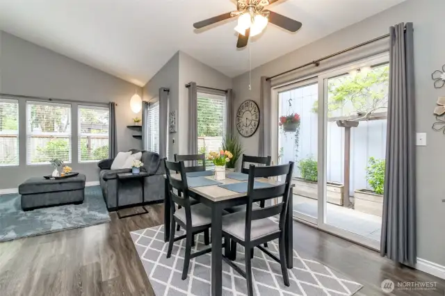 This dining area includes a fan w/light and a slider opens to the outside.