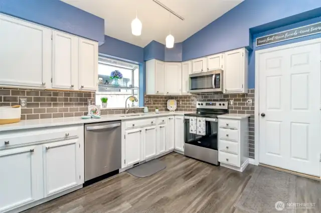 Bring groceries in from the garage through the convenient door into the kitchen.