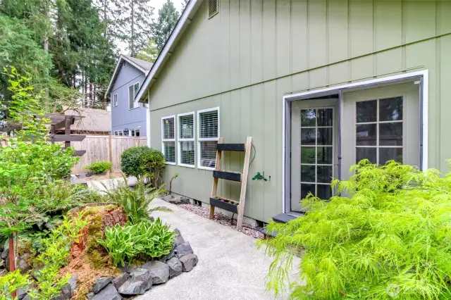 The main bedroom with French doors opens into the backyard. There is also a magnetized screen door that keeps the bugs out when the doors are open.