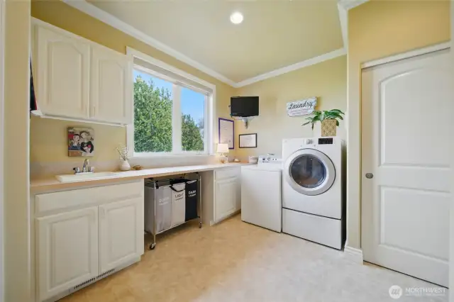 Laundry sink, utility closet and extra storage, connects to bedroom hallway
