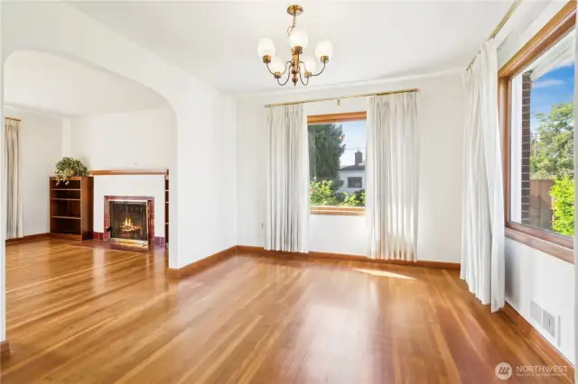 Dining room is a bright Southwest corner. Arched entry to living room.