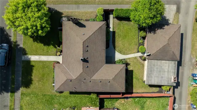 Ariel view of this tidy property. Notice the alley behind the home for garbage pickup.