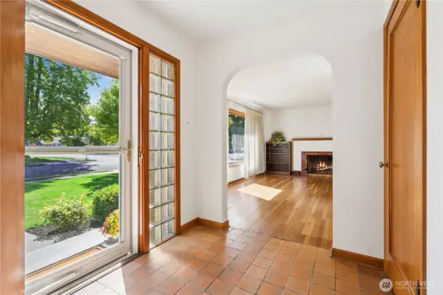 Terra Cotta tile entry greets your guest at the front door. Glass blocks on both sides of soild wood door allow light even on the darker days.