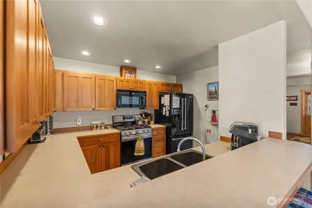 Custom quarter-sawn oak cabinets and ample counter space in the kitchen.