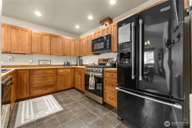 Modern appliances and tile floors in the tidy kitchen.
