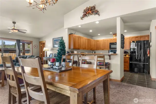 Seating for 7+, at the dining table and kitchen counter.