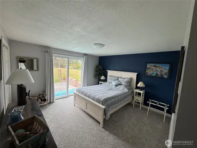 Second bedroom with sliding glass door to back deck