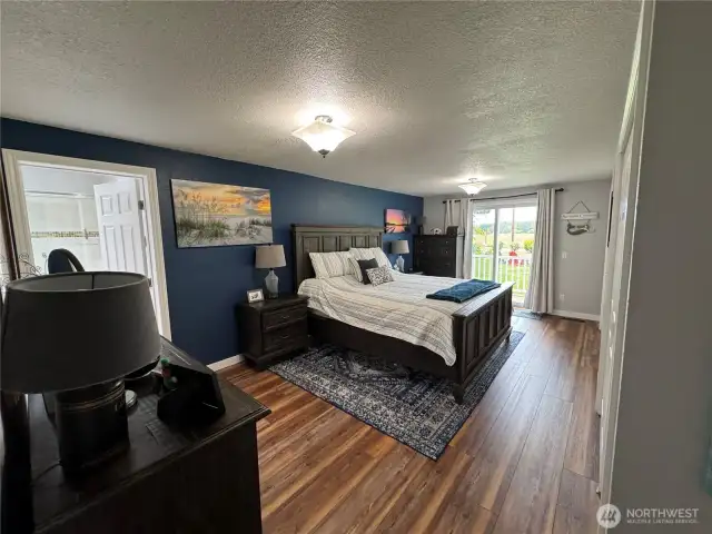 Primary bedroom with sliding glass for to front deck